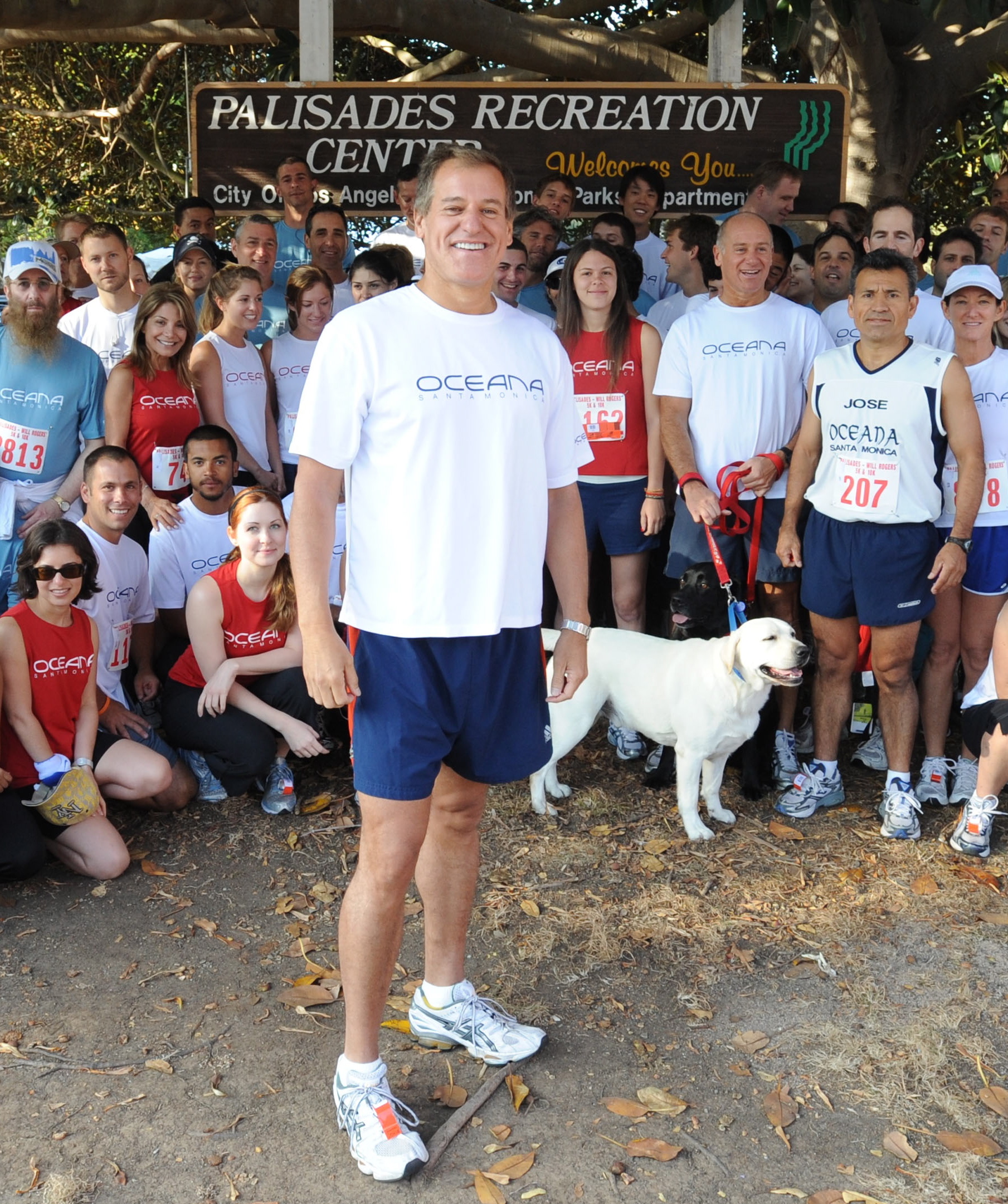 JRK Property Holdings CEO Jim Lippman (front), his staff and families don their familiar Oceana t-shirts before the start of last Saturday morning's Palisades-Will Rogers 5/10K.